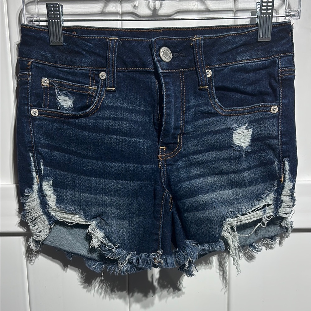 American Eagle very distressed midi blue jean shorts